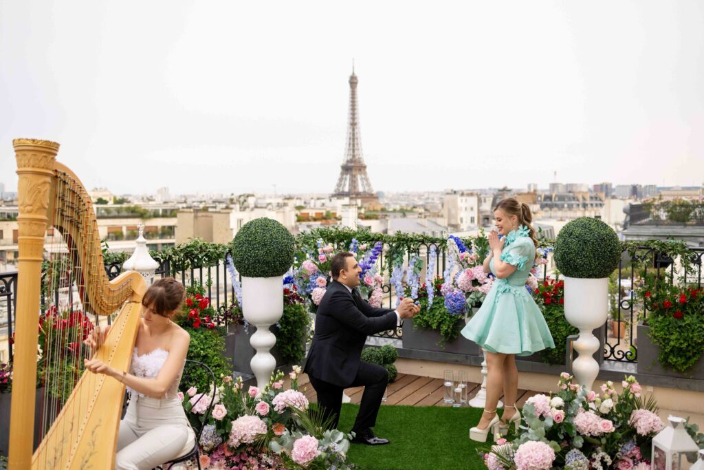 Luxury rooftop proposal with floral decor and city skyline view