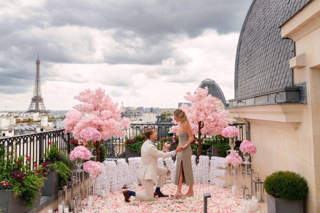 Rooftop proposal with floral decor and Eiffel Tower view